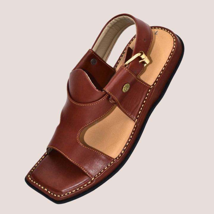 Brown sandal with a gold buckle on a white background