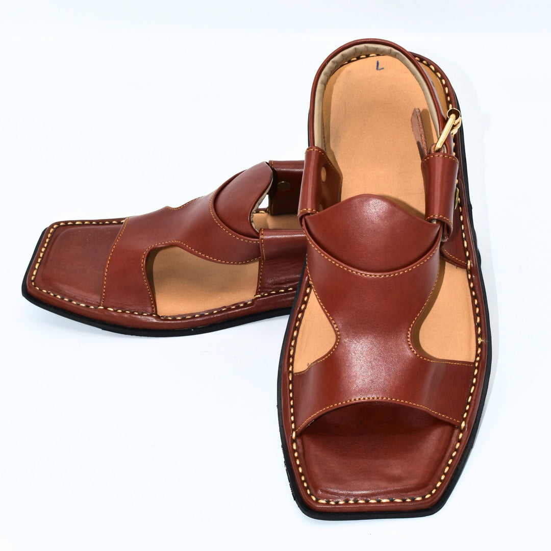 Pair of brown leather sandals on a white background
