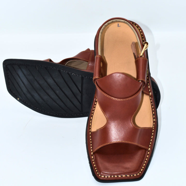 Brown sandal with open toe design on a white background